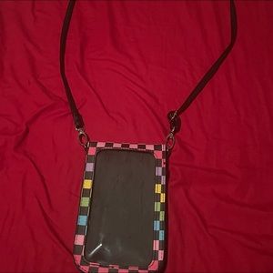 This is a hanging side bag where you can put your phone into it and stuff!